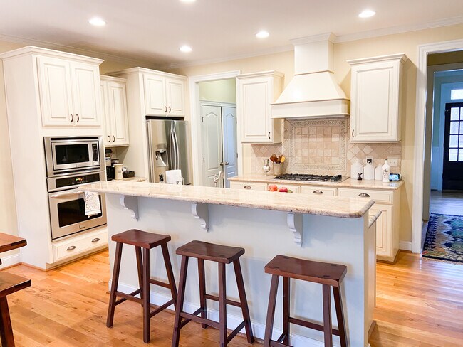 Custom kitchen features granite and tile backsplash, plus large pantry, all appliances - 309 Redhill Road