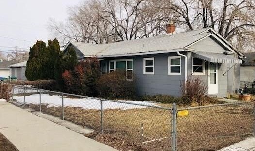 Front of home showing fenced yard - 564 W 10th St