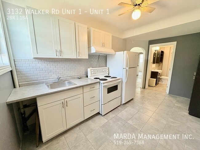 Building Photo - COZY 2 BEDROOM 1 BATH MAIN FLOOR UNIT - WALKER RD + HYDRO!