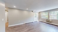 Located at 4 Olde Derby Road in Norwood, MA, this single-floor home offers four bedrooms, two bathrooms, and a thoughtfully designed layout ideal for comfortable living. The open living room is bright and welcoming, featuring durable hardwood-style flooring, recessed lighting, a textured ceiling, and baseboard heating. Natural light filters in through multiple windows, including a charming glass-panel entry door that adds character to the space. The kitchen is a standout feature, outfitted with white shaker cabinets, dark granite countertops, a subway tile backsplash, and a full suite of stainless steel appliances including a range, dishwasher, microwave, and refrigerator. The bedrooms are carpeted for warmth and comfort, with several featuring ample closet space, including a spacious walk-in closet with wire shelving. Both bathrooms are finished with neutral large-format tile and white vanities. One bathroom offers a soaking tub with tiled surround, while the second features a neo-angle glass-enclosed shower. A central hallway connects the rooms efficiently, and two dedicated closets provide additional storage throughout the home.