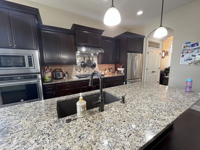 Building Photo - Stylish 5-Bedroom Home with Modern Kitchen...