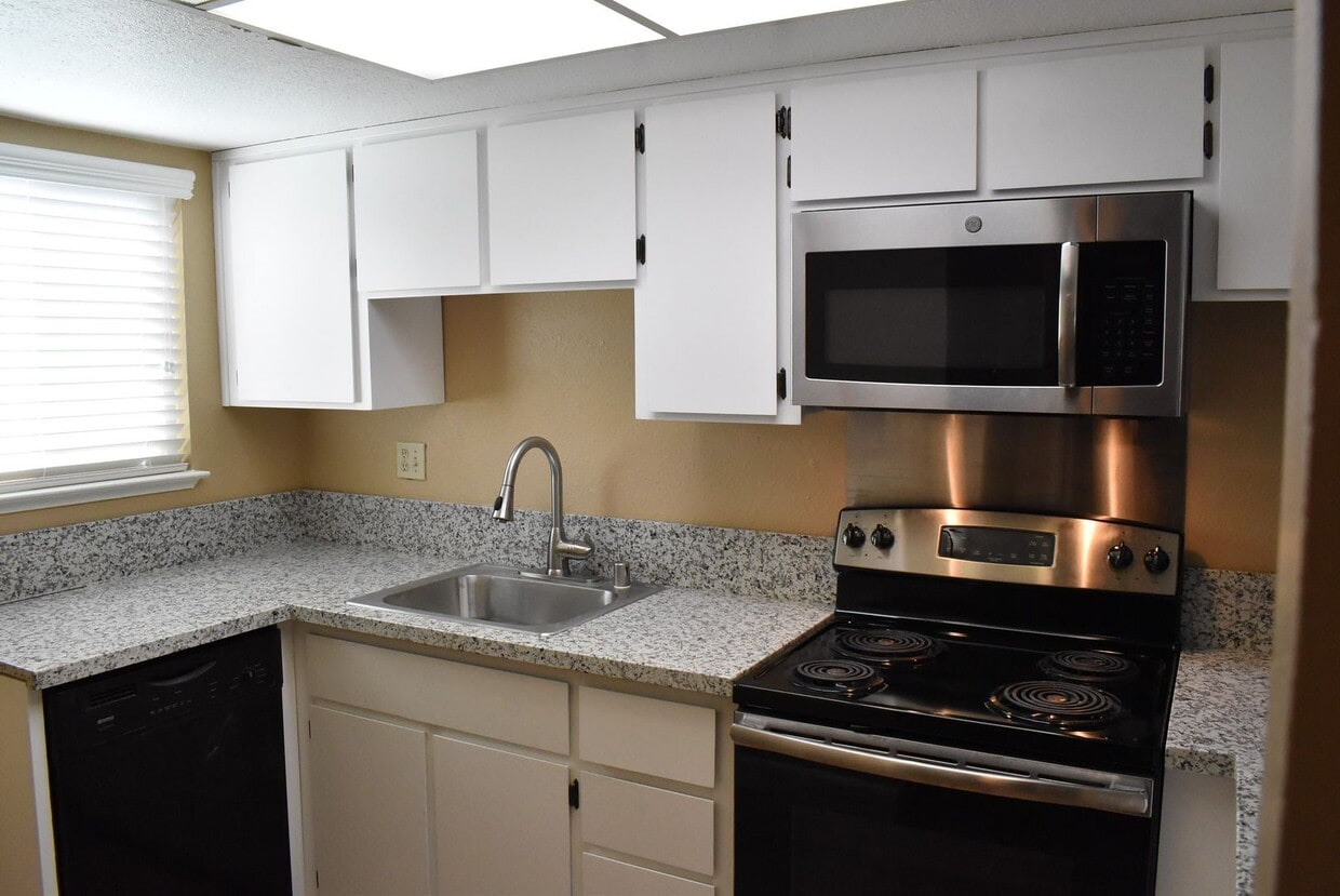 Primary Photo - Condo unit featuring updated kitchen with ...