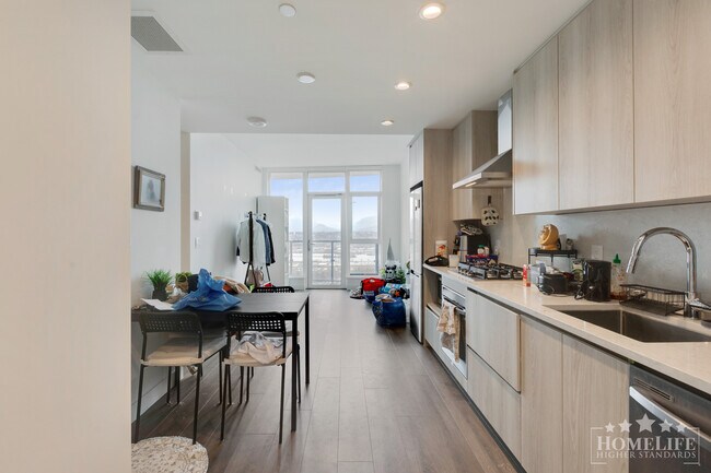 Building Photo - Modern 1 Bed + Den Condo in Surrey City Centre with Premium Amenities