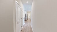 Located at 1330 Nashville Pike in Gallatin, TN, this two-bedroom, two-bathroom residence offers a thoughtfully designed single-floor layout with modern finishes throughout. Light wood-style flooring flows seamlessly across all rooms, creating a bright and cohesive aesthetic.

The open-concept kitchen and living area serves as the heart of the home. The kitchen features white shaker cabinetry, granite countertops, stainless steel appliances including a refrigerator, electric range, and microwave, and a central island with a undermount sink — ideal for both meal prep and casual dining.

Both bedrooms are well-proportioned and filled with natural light from large windows fitted with horizontal blinds. Ceiling fans are present in each bedroom, contributing to year-round comfort. The spacious primary bedroom includes direct access to a dedicated closet area. Each bedroom offers a calm, neutral palette with clean lines.

The two bathrooms are finished with granite-topped white vanities, wood-style flooring, and white subway tile surrounding the tub-shower combinations. Built-in open shelving in one bathroom adds practical storage. A second closet provides additional organizational space within the unit.

Overall, the residence presents a clean, contemporary feel with consistent, quality finishes suitable for comfortable everyday living in Gallatin, Tennessee.