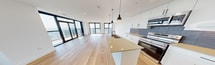 This contemporary 490 square foot apartment at 110 Fullarton, 3006, maximizes its compact footprint with a thoughtful layout. The space comprises one bedroom, one bathroom, and an open-concept living area. Floor-to-ceiling windows in the living room and bedroom flood the space with natural light and offer breathtaking city views.

The kitchen boasts sleek, modern appliances, including a stainless steel refrigerator and oven. White cabinetry is complemented by a geometric tile backsplash, while pendant lighting adds a touch of sophistication. A breakfast bar with seating for three separates the kitchen from the living area.

The living room features a comfortable gray sofa, accent chair, and round coffee table, all resting on a natural fiber rug atop hardwood flooring. The bedroom accommodates a queen-size bed and offers ample closet space with sliding doors. 

The bathroom is efficiently designed with a combined tub and shower, featuring a curved shower rod and clean white tiles. A wooden vanity provides storage beneath the sink.

Throughout the apartment, the color palette is primarily neutral, creating a sense of spaciousness. Strategic placement of plants and artwork adds warmth and personality to the space. The apartment also includes modern amenities such as recessed lighting and a wall-mounted air conditioning unit, ensuring comfort in this stylish urban dwelling.