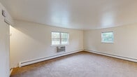 Located at 150 E Atlantic Ave in Somerdale, NJ, this one-bedroom, one-bathroom unit offers a practical and comfortable single-floor layout. The living room is generously sized, featuring neutral carpet flooring, cream-toned walls, and multiple windows that allow ample natural light and views of the surrounding greenery. Baseboard heating and a wall-mounted air conditioning unit ensure year-round comfort. The adjoining dining area flows naturally from the living space, with hardwood flooring that extends into the kitchen. The kitchen is efficiently designed with warm oak cabinetry, dark speckled countertops, a gas range, an over-the-range microwave, and a window above the sink that brings in additional natural light. The bedroom offers a comfortable footprint with plush carpet flooring, a closet, and a window with outdoor views. Two additional closets throughout the unit provide generous storage. The bathroom is finished in crisp white, featuring a tub/shower combination with tiled surround, a window for natural ventilation, and tile flooring. With three closets total, the unit offers practical storage solutions throughout. The clean, neutral palette and functional layout make this a versatile and move-in-ready space.