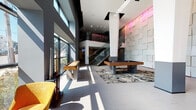 Located at 120 N Pearl St in Port Chester, NY, this contemporary two-floor amenity space showcases a striking modern design defined by soaring double-height ceilings and an abundance of natural light streaming through expansive floor-to-ceiling windows. The ground floor serves as the centerpiece of the space, featuring a spacious open-plan layout anchored by a full-size billiards table and a shuffleboard table, both positioned atop a bold abstract-patterned area rug. Sculptural lounge seating in vibrant lime green and orange offers inviting gathering spots, complemented by a low-profile coffee table. A dramatic textured wall installation of three-dimensional geometric panels spans the full height of the main area, bathed in dynamic color-changing accent lighting that adds a distinctive artistic focal point. A glass-railed staircase with sleek metal handrails connects the floors, contributing to the open, airy feel of the interior. The ground floor also includes an elevator lobby and building access corridor. On the second floor, an open mezzanine overlooks the main level through glass railings, and a dedicated conference room is equipped with a large wall-mounted display, a meeting table, and ergonomic seating, making it well-suited for professional gatherings.