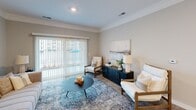 This contemporary 1020 square foot apartment offers a harmonious blend of comfort and style. The open-concept living area seamlessly integrates the kitchen and living room, creating a spacious and inviting atmosphere. The kitchen boasts modern stainless steel appliances, ample white cabinetry, and a practical island with seating, perfect for casual dining or entertaining.

Two well-appointed bedrooms provide ample space for rest and relaxation. The primary bedroom, measuring 170 square feet, features plush carpeting and large windows that flood the space with natural light. Both bathrooms are designed with functionality in mind, offering clean lines, modern fixtures, and generous counter space.

Throughout the apartment, a neutral color palette creates a sense of calm and continuity. Light wood-look flooring in the main living areas adds warmth and complements the overall design. Thoughtful lighting, including recessed fixtures, ensures a bright and welcoming ambiance.

Artistic touches, such as carefully curated wall art and decorative accessories, add personality to the space. The living room features comfortable seating arrangements, perfect for lounging or entertaining guests. Large windows with vertical blinds allow for privacy control while maximizing natural light.

This well-designed apartment combines practicality with contemporary aesthetics, offering a turnkey living solution in the heart of Marysville, Ohio.