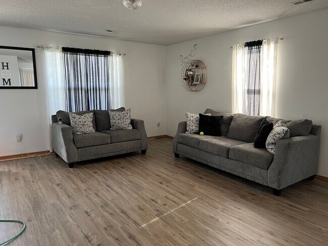 Luxury vinyl flooring in main living areas and kitchen - 2402 E Conquest St