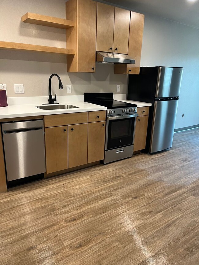 Building Photo - Beautiful, Brand New One Bedroom Loft Near...