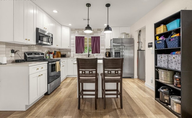 Building Photo - Modern 4-Bedroom Ranch-Style Home with Spa...