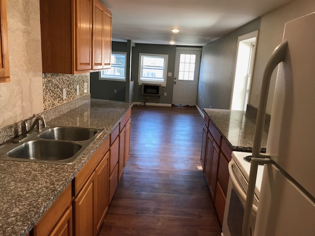Kitchen features granite counters - 108 E Main St