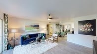 Located at 3033 E Thunderbird Rd in Phoenix, Arizona, this single-floor unit offers a well-designed, open layout that seamlessly connects the living, dining, and kitchen areas. The living room is anchored by light wood-style flooring, a ceiling fan, and large sliding glass doors that open to a private patio with pleasant outdoor views — allowing natural light to fill the space. The dining area features a round marble-top table, sage green chairs, tall gold-framed mirrors, and hanging greenery, creating a fresh and airy atmosphere. Adjacent to the dining space is an in-unit laundry area for added convenience. The galley-style kitchen is well-appointed with white cabinetry, stainless steel appliances, a subway tile backsplash, and ample counter and storage space. The bedrooms are carpeted for comfort, each featuring ceiling fans, generous closet space with mirrored doors, and windows with decorative curtains that allow natural light. The bathroom includes a clean, white vanity and a shower-tub combination. Throughout the unit, a cohesive design aesthetic blends modern and botanical elements, giving the space a vibrant yet relaxed character well-suited to the Phoenix lifestyle.