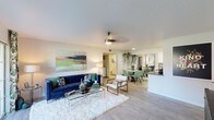 Located at 3033 E Thunderbird Rd in Phoenix, Arizona, this single-floor unit offers a well-designed, open layout that seamlessly connects the living, dining, and kitchen areas. The living room is anchored by light wood-style flooring, a ceiling fan, and large sliding glass doors that open to a private patio with pleasant outdoor views — allowing natural light to fill the space. The dining area features a round marble-top table, sage green chairs, tall gold-framed mirrors, and hanging greenery, creating a fresh and airy atmosphere. Adjacent to the dining space is an in-unit laundry area for added convenience. The galley-style kitchen is well-appointed with white cabinetry, stainless steel appliances, a subway tile backsplash, and ample counter and storage space. The bedrooms are carpeted for comfort, each featuring ceiling fans, generous closet space with mirrored doors, and windows with decorative curtains that allow natural light. The bathroom includes a clean, white vanity and a shower-tub combination. Throughout the unit, a cohesive design aesthetic blends modern and botanical elements, giving the space a vibrant yet relaxed character well-suited to the Phoenix lifestyle.