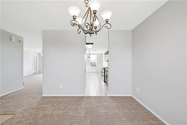 Formal dining. Woodgrain tile in kitchen not pictured. - 1419 Windy Meadows Dr