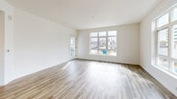 Located at 3093 Broadway in Oakland's vibrant Pill Hill neighborhood, this well-appointed two-bedroom, two-bathroom residence offers a clean, modern aesthetic throughout. The open-concept living and dining area is anchored by warm wood-look flooring and crisp white walls, creating a bright and welcoming atmosphere. A glass-panel door leads to a private balcony with railing, extending the living space outdoors with views of the surrounding neighborhood.

The kitchen is a standout feature, showcasing rich walnut-toned cabinetry, a classic white subway tile backsplash, and a full suite of stainless steel appliances including a gas range, microwave, dishwasher, and refrigerator. Recessed lighting and a large window fill the space with natural light.

Both bedrooms are carpeted and well-proportioned, with large windows framing neighborhood views. The primary bedroom includes a walk-in closet with built-in shelving and rod storage. The primary bathroom features tile flooring, a glass-enclosed shower, and direct access to the walk-in closet. The second bathroom offers a modern vanity with wood cabinetry, a white countertop, a large mirror, and a glass shower enclosure.

Additional highlights include a dedicated laundry area, a utility room, a hallway with recessed lighting, and three closets throughout. This residence combines practical functionality with contemporary design in a convenient Oakland location.