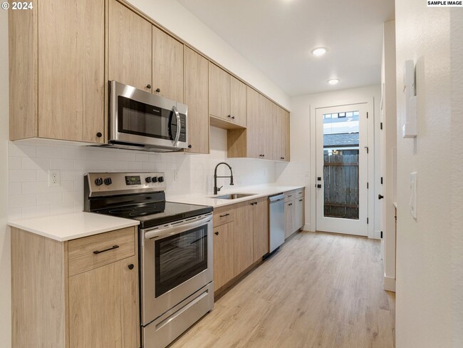 Building Photo - Modern 2-Bed, 1.5-Bath Condo with Custom K...