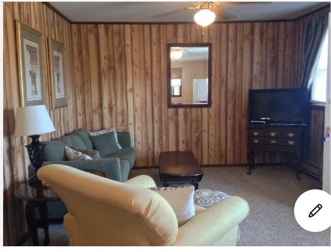 Apt A living room (yellow chair replaced with Lazy Boy leather recliner) - 1001 N Park Ave