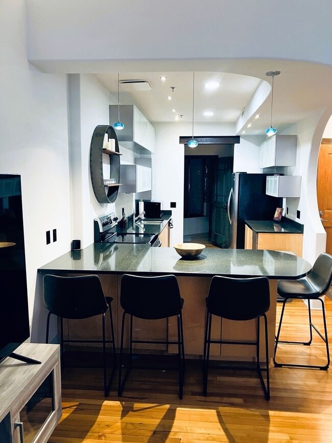 Building Photo - Turn-Key Downtown Asheville Condo | Historic Old Penney’s Building | Rooftop Views