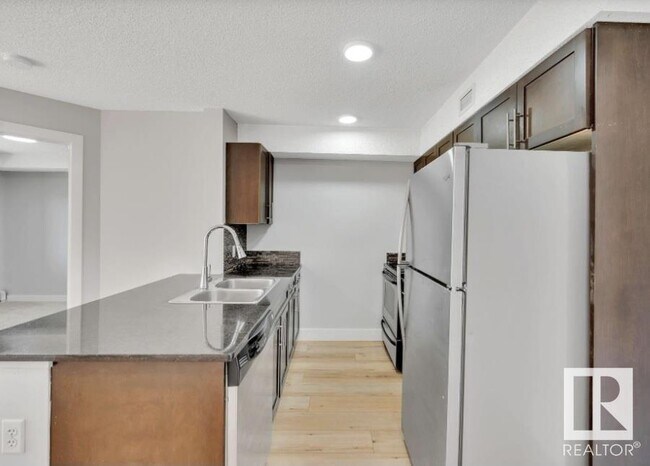 Photo du bâtiment - 11820 22 Ave SW