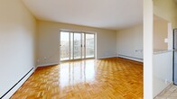 Located at 1201 Richmond St in London, Ontario, this two-bedroom, one-bathroom unit offers a well-organized single-floor layout with a clean, neutral aesthetic throughout. Classic parquet wood flooring runs through the living spaces and bedrooms, adding warmth and texture to each room.

The combined kitchen and living area forms the heart of the unit. The kitchen is fitted with warm wood cabinetry, granite-look countertops, and a stainless steel sink, providing ample storage and prep space. The adjoining living area is generously proportioned, featuring large sliding glass doors that open to a balcony, flooding the space with natural light and offering views of the surrounding urban landscape.

Both bedrooms are comfortably sized, with the primary bedroom offering notable room to furnish flexibly. Each bedroom benefits from natural light via windows with city views, parquet flooring, and closet storage — one bedroom features a rod closet with shelf, and the other a full sliding-door closet.

A connecting hallway links the rooms efficiently, with the bathroom located conveniently off this corridor. The bathroom is finished with tile flooring, a tiled tub-shower surround with decorative accent tiles, a white vanity with granite-look countertop, and a well-lit mirror above.

The unit presents a practical, comfortable layout suited to a variety of lifestyles.