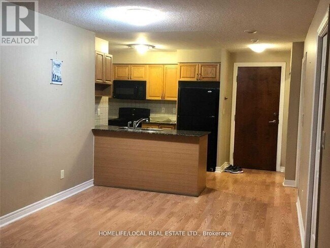 Photo du bâtiment - 310-3310 Burnhamthorpe Rd W