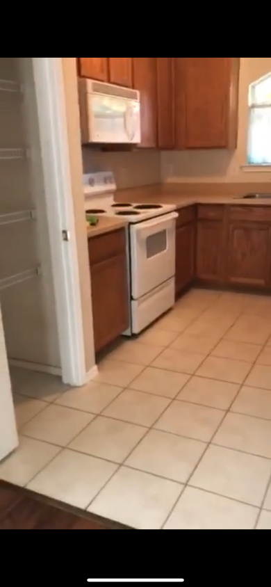 Kitchen with plenty of counter space, tile floor, easy to clean. - 3516 Lake Hill Ln