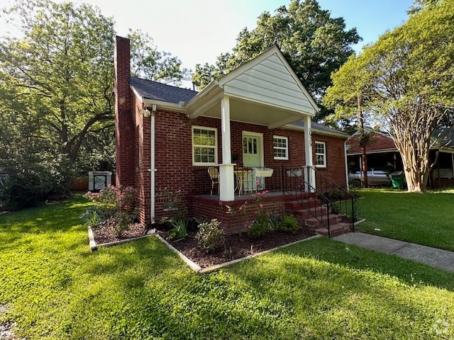 Front of house including porch and lovely yard on quiet cul de sac - 3525 Mathis Dr