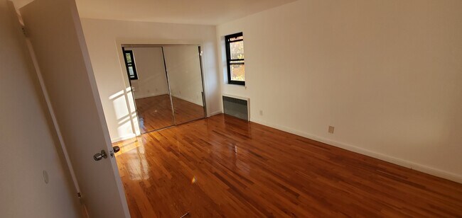 large mirrored closet in bedroom, great light - 110 Fisher Ave