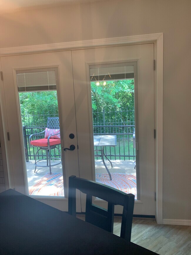 View to outside from dining area, built in privacy blinds - 614 Cooper Estates Dr