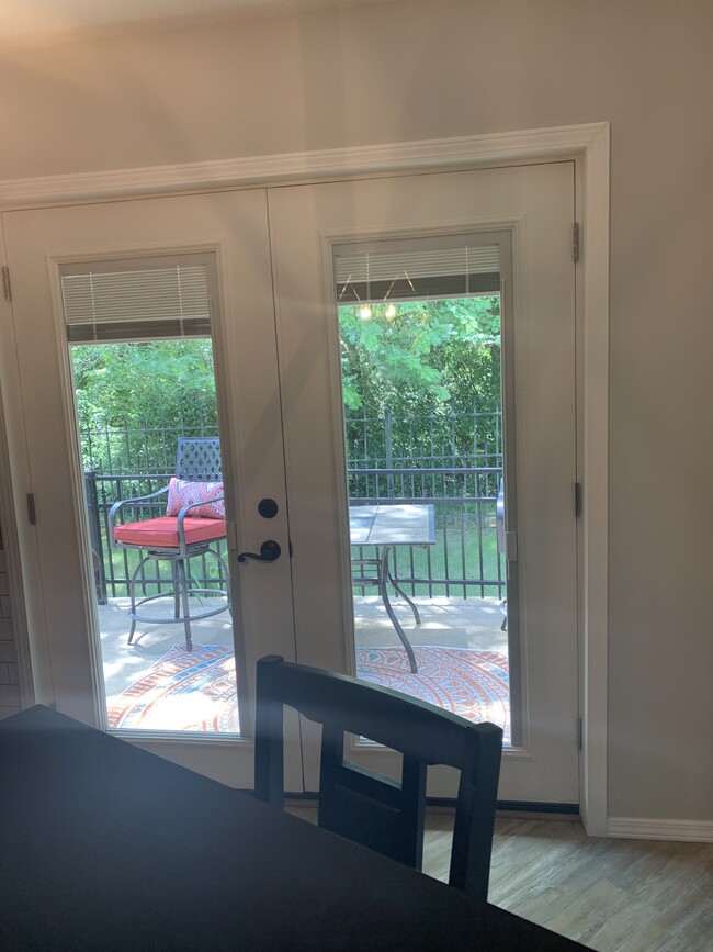 View to outside from dining area, built in privacy blinds - 614 Cooper Estates Dr