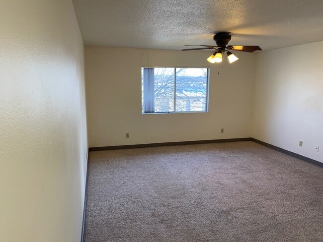 living room with ceiling fan - 2250 9th St
