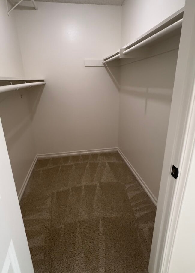 *2 Bedroom walk in closet interior unit. - Sun Harbour Apartments