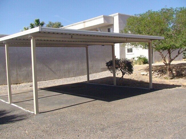 One assigned parking space in carport - 1790 North Ave