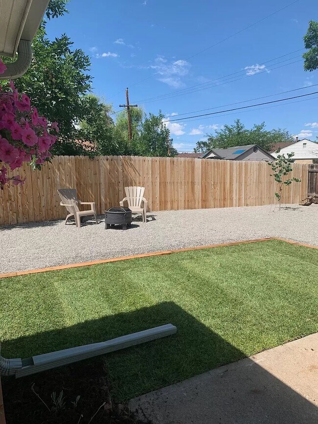 Fenced in backyard with areas for a firepit and gardening - 5500 Dudley Ct