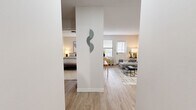 Located at 200 E Webster St in Nashville, TN, this single-floor, one-bedroom, one-bathroom residence offers a thoughtfully arranged layout that makes efficient use of its compact footprint. The unit is organized around a bright, open living room featuring light hardwood-style flooring, neutral walls, and windows with horizontal blinds that invite natural light into the space. The living area provides a comfortable setting with ample room for seating and décor.

The galley-style kitchen is positioned along a dedicated corridor and features gray cabinetry with gold-tone hardware, white appliances including a refrigerator, electric range, and dishwasher, along with tile flooring and a double sink — offering a well-equipped and organized cooking space.

The bedroom is carpeted and benefits from a window that brings in natural light, creating a calm and restful atmosphere. The room comfortably accommodates a bed and additional furnishings, making it a practical private retreat.

The full bathroom includes a shower-tub combination, vanity with storage, and coordinating tile flooring, providing all essential amenities in a clean, well-maintained space.

Throughout the unit, white walls and consistent finishes create a cohesive, move-in-ready aesthetic. A central structural column adds architectural character to the entryway, subtly separating the living and sleeping areas.