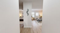 Located at 200 E Webster St in Nashville, TN, this single-floor, one-bedroom, one-bathroom residence offers a thoughtfully arranged layout that makes efficient use of its compact footprint. The unit is organized around a bright, open living room featuring light hardwood-style flooring, neutral walls, and windows with horizontal blinds that invite natural light into the space. The living area provides a comfortable setting with ample room for seating and décor.

The galley-style kitchen is positioned along a dedicated corridor and features gray cabinetry with gold-tone hardware, white appliances including a refrigerator, electric range, and dishwasher, along with tile flooring and a double sink — offering a well-equipped and organized cooking space.

The bedroom is carpeted and benefits from a window that brings in natural light, creating a calm and restful atmosphere. The room comfortably accommodates a bed and additional furnishings, making it a practical private retreat.

The full bathroom includes a shower-tub combination, vanity with storage, and coordinating tile flooring, providing all essential amenities in a clean, well-maintained space.

Throughout the unit, white walls and consistent finishes create a cohesive, move-in-ready aesthetic. A central structural column adds architectural character to the entryway, subtly separating the living and sleeping areas.