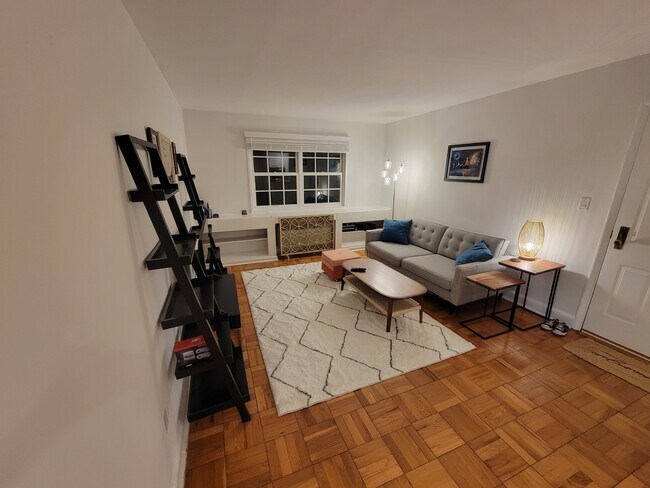 Living room with large window. - 1714 W Abingdon Dr