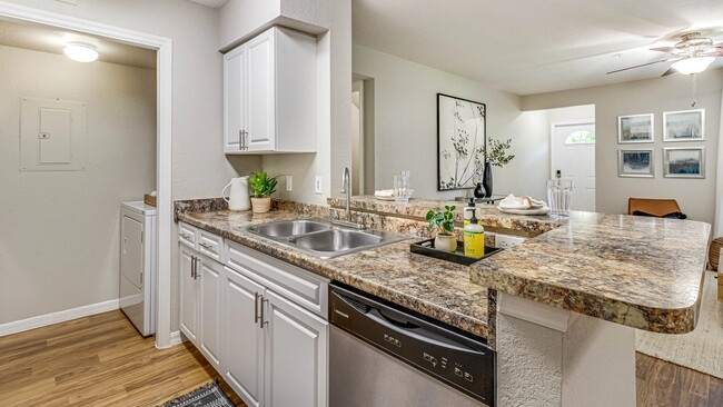 Gorgeous open kitchens offer seamless entertainment. - Meadow Lakes