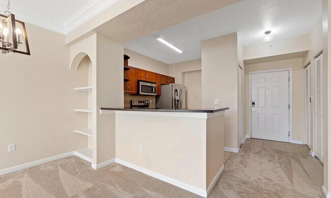 Building Photo - This unique and well manicured unit offers...