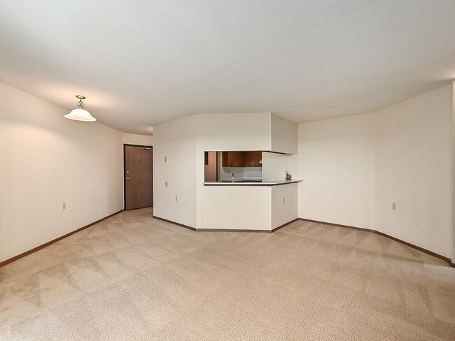 Living Room with Kitchen - Rivers Edge Apartments