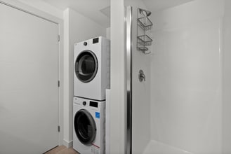 Enjoy the convenience of in-home laundry with a fresh, updated bathroom. - The Ruby