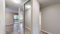 Located at 400 Santa Alicia Dr in Rohnert Park, CA, this 2-bedroom, 1-bathroom residence offers a well-organized single-level layout designed for comfortable everyday living. The living room serves as the heart of the home, finished with light wood-look flooring, a ceiling fan, and a sliding glass door that opens to a private balcony, flooding the space with natural light and views of surrounding greenery. Adjacent to the living room, the galley-style kitchen is thoughtfully appointed with white shaker cabinetry, ample upper and lower storage, light countertops, a stainless steel refrigerator, an electric range, and a double sink — all tied together by matching wood-look flooring. The two bedrooms are carpeted in warm neutral tones and feature windows that bring in natural light. The primary bedroom includes mirrored sliding closet doors, adding a sense of depth and dimension. The second bedroom also benefits from a baseboard heating unit and a generously sized window. The full bathroom features a white vanity with cabinet storage, a wall mirror, and wood-look flooring that ties into the rest of the home. Textured ceilings and neutral wall tones are consistent throughout, lending the space a clean, cohesive aesthetic.
