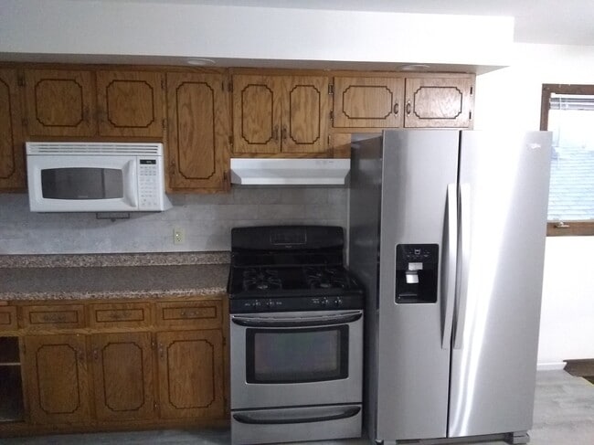 Kitchen with stainless steel appliances - 1100 Rahill Ct