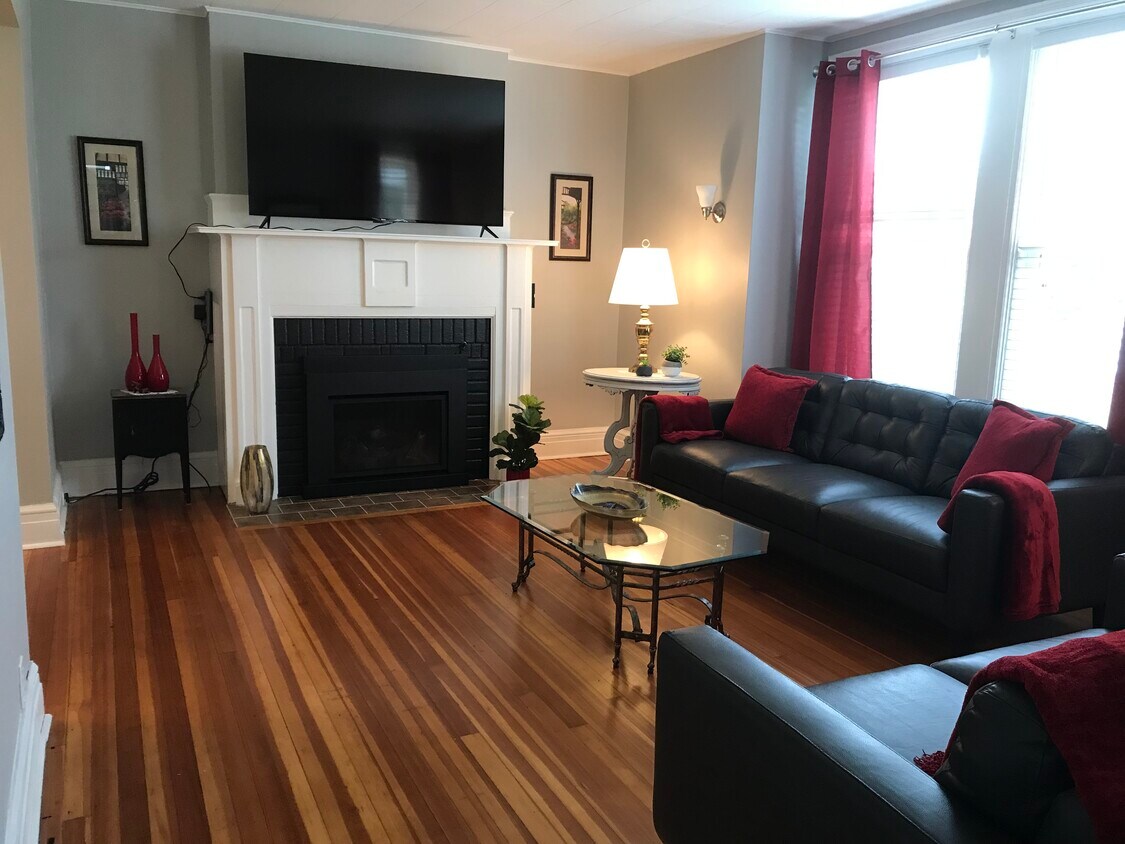 Living room w/leather couch, 65” tv, gas fireplace - 22 Hillside Ave