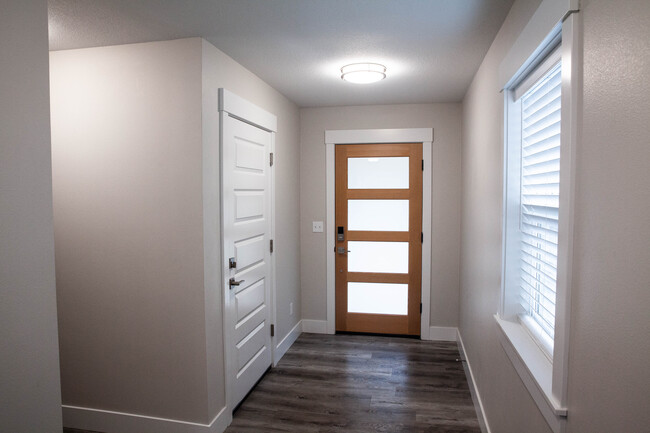 Front door, entrance to garage and stairs on the left - 217 Oak St