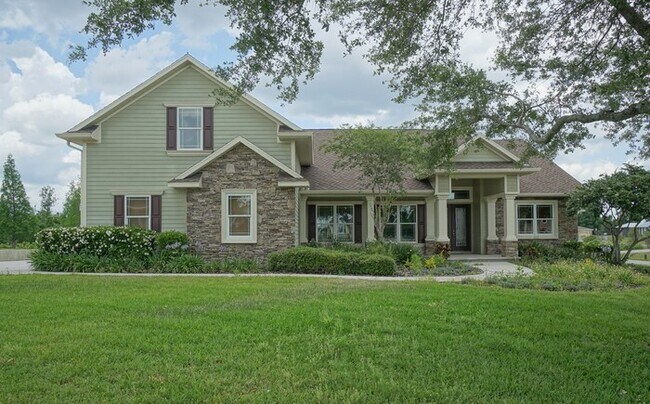 Building Photo - 4-bedroom, 3-bath and 3.5-car garage on pond