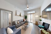 Located in Atlanta's vibrant Westside neighborhood, this well-appointed 4-bedroom, 4-bathroom residence offers a thoughtfully designed single-floor layout. Wood-look flooring flows throughout, tying the space together with a clean, contemporary aesthetic. The open-concept kitchen and living area serves as the heart of the home, featuring a granite-topped peninsula with bar seating, modern pendant lighting, stainless steel appliances, and sleek two-tone cabinetry. The adjacent living room is bright and airy, with elevated ceilings, a ceiling fan, and large windows with patio door access that fill the room with natural light. Each of the four bedrooms offers a comfortable and private retreat, with generous windows, neutral walls, and access to dedicated bathrooms. The bathrooms are consistently finished with granite vanity countertops, wood-toned cabinetry, full tub-shower combinations, and large mirrors. The primary bedroom provides a cozy yet functional space with ample natural light. Additional conveniences include a dedicated laundry room with in-unit washer and dryer, two closets, and a central hallway connecting all areas of the home seamlessly. This residence combines modern design with practical living in a prime Atlanta location.