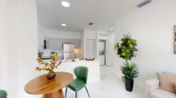 Located at 1451 W 29th St in Hialeah, FL, this well-designed one-bedroom, one-bathroom residence offers a clean, modern aesthetic throughout its efficiently laid-out single floor. The open-concept living and dining area is anchored by gleaming light-toned tile flooring and bright white walls, creating an airy ambiance that is further enhanced by a large window that invites natural light and street views into the space. The kitchen is thoughtfully designed with gray flat-panel cabinetry, white countertops, stainless steel appliances including a refrigerator, range, and built-in microwave, and a peninsula that connects seamlessly to the dining and living areas. A dedicated in-unit laundry area adds everyday convenience. The spacious primary bedroom accommodates a full suite of furniture comfortably, features a window with natural light, and is served by two closets for ample storage. The bathroom is finished in crisp white tile and includes a full bathtub with shower. Throughout the residence, recessed lighting and a consistent white palette maintain a bright, cohesive feel, making this Hialeah home a practical and stylish living space.