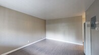 Located at 2927 Marconi Ave in the Arden-Arcade neighborhood of Sacramento, CA, this single-story, 3-bedroom, 2-bathroom home offers a practical and well-organized layout. The interior features a mix of durable vinyl plank flooring throughout the main living areas and bedrooms, with a neutral color palette of warm greiges and crisp white trim that lends a clean, move-in-ready feel.

The kitchen is efficiently designed with white cabinetry, granite-style countertops, a double stainless steel sink, and stainless steel appliances including a refrigerator and electric range. A ceiling fan keeps the space comfortable, and the kitchen opens to the main living area for easy flow.

The spacious primary bedroom features plush carpeting, dual windows that allow for natural light, and a ceiling fan. Additional bedrooms offer vinyl plank flooring, ceiling fans, closet storage, and windows providing ventilation and light. Across the home, four closets provide ample storage.

Both bathrooms are bright and clean, each featuring a tub-shower combo, window for natural light, and vinyl plank flooring. One bathroom includes a vanity with under-sink storage, while the other features a pedestal sink. The hallway connects all rooms efficiently within the compact single-floor footprint.